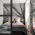 Mustavalkoinen tapetti makuuhuoneeseen Opulence Lines R18597 Rebel Wallsilta